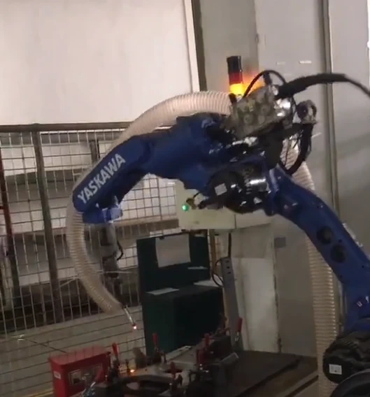 Yaskawa welding robot equipped with synchronized point-of-origin fume extraction hose